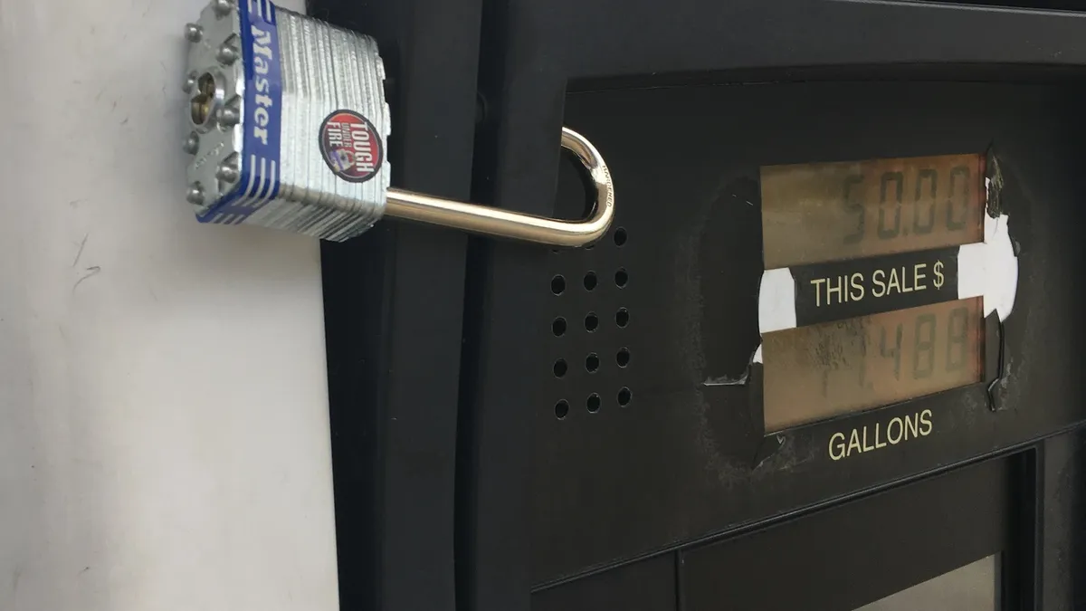 Security lock on a gas pump card reader to prevent skimmer installation